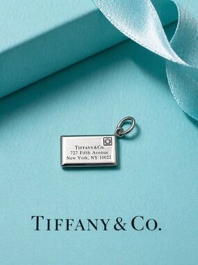 Tiffany & Co. Sterling Silver Envelope w/ Single Diamond Pendant